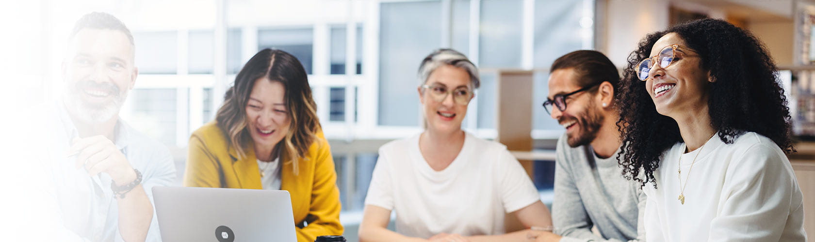 Cheerful professionals having a meeting in an office
